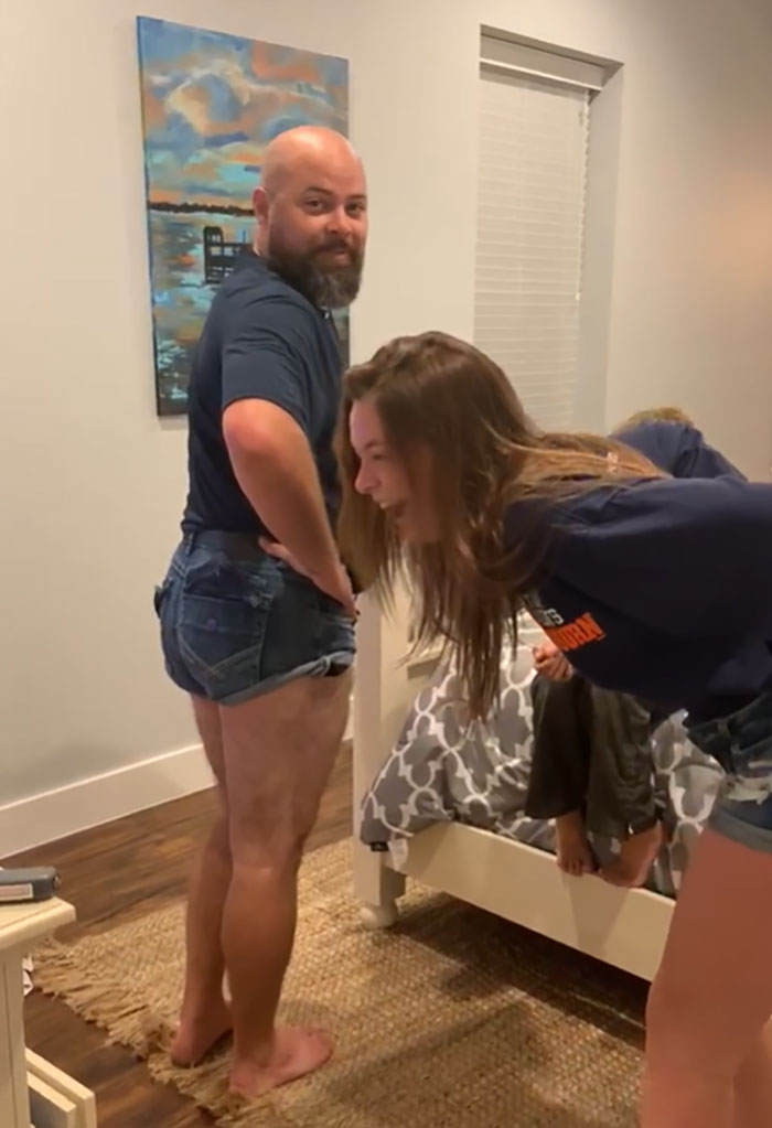 Dad helps daughter stretch