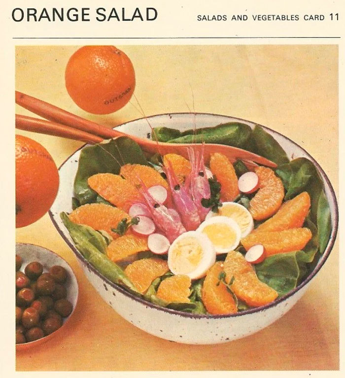 There an orange in the salad. Retro food.