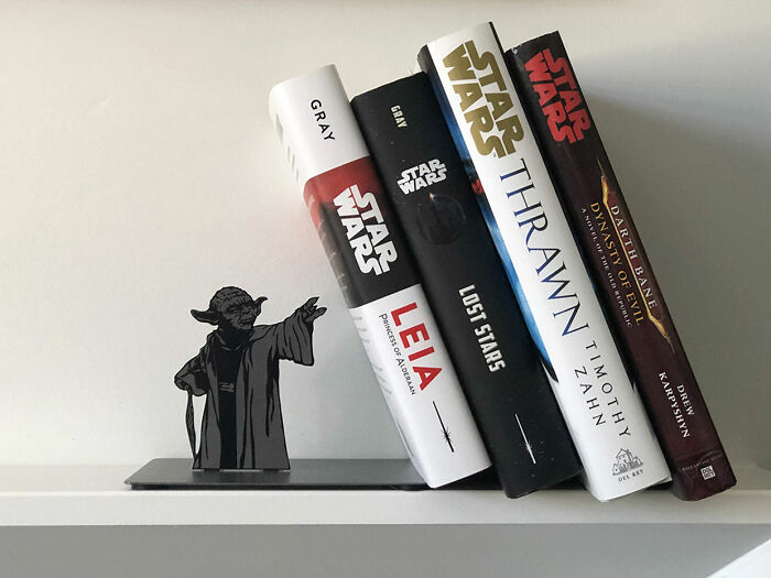 This Yoda Bookend That Looks Like Yoda Is Holding The Books Up With The Force