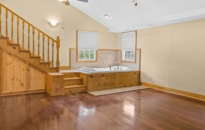 In Our Home Search….i Have Seen Some Odd Things…. But I Have Looked At This Photo A Hundred Times…. And Still Cannot Figure Out Why In The Heck… Would A Bathtub Not Only Be In The Living Room…. But At The Bottom Of The Stairs