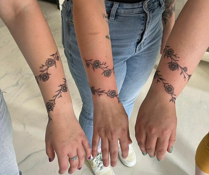 Family daisy armband tattoo
