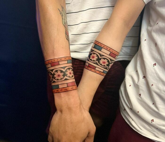 Matching watercolors armband tattoos