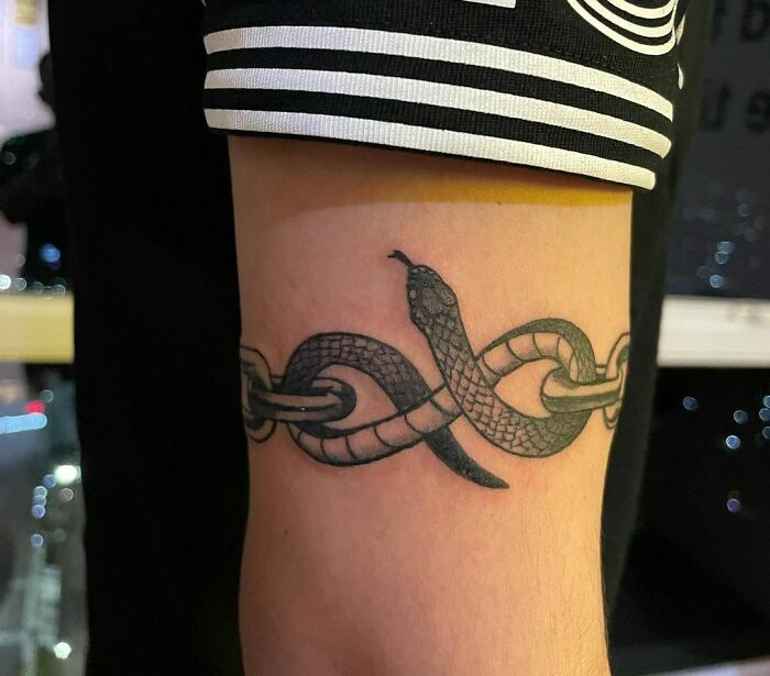 Snake armband tattoo