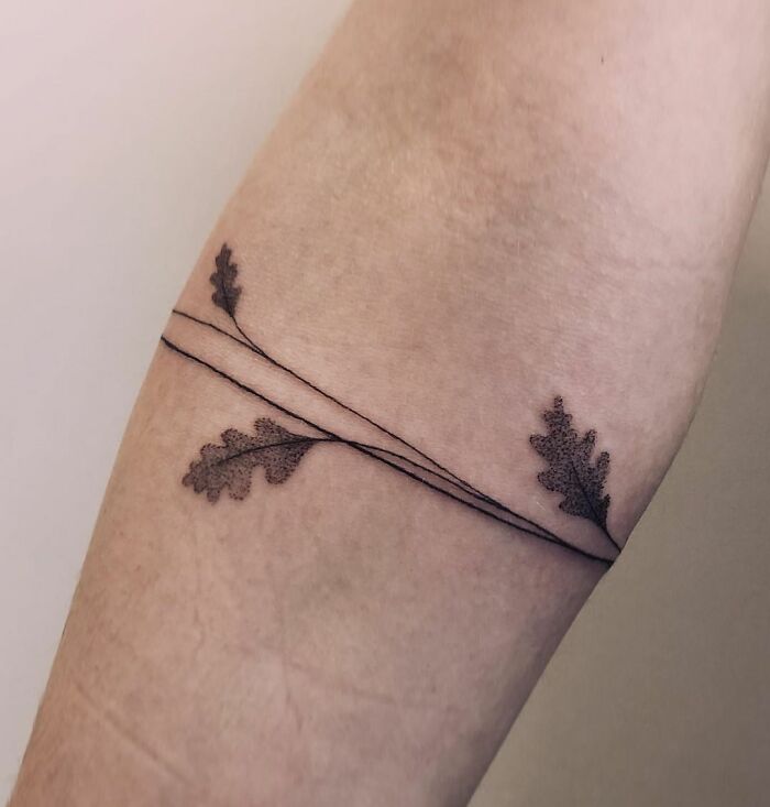 Maple leaves armband tattoo