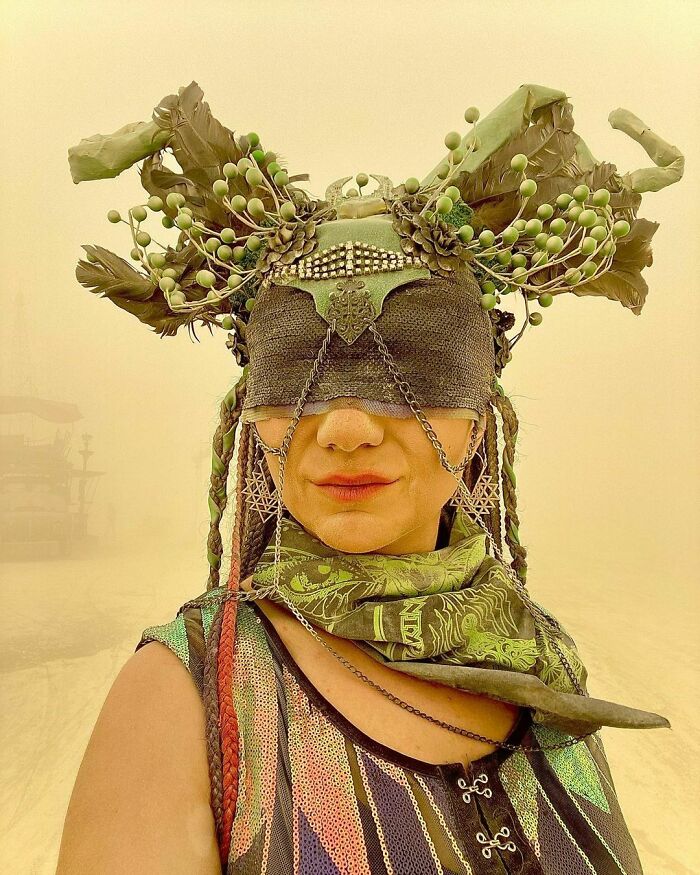 Woman wearing costume with her eyes covered 