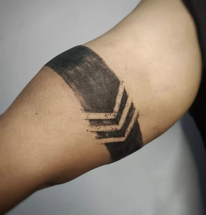 Moving forward armband tattoo