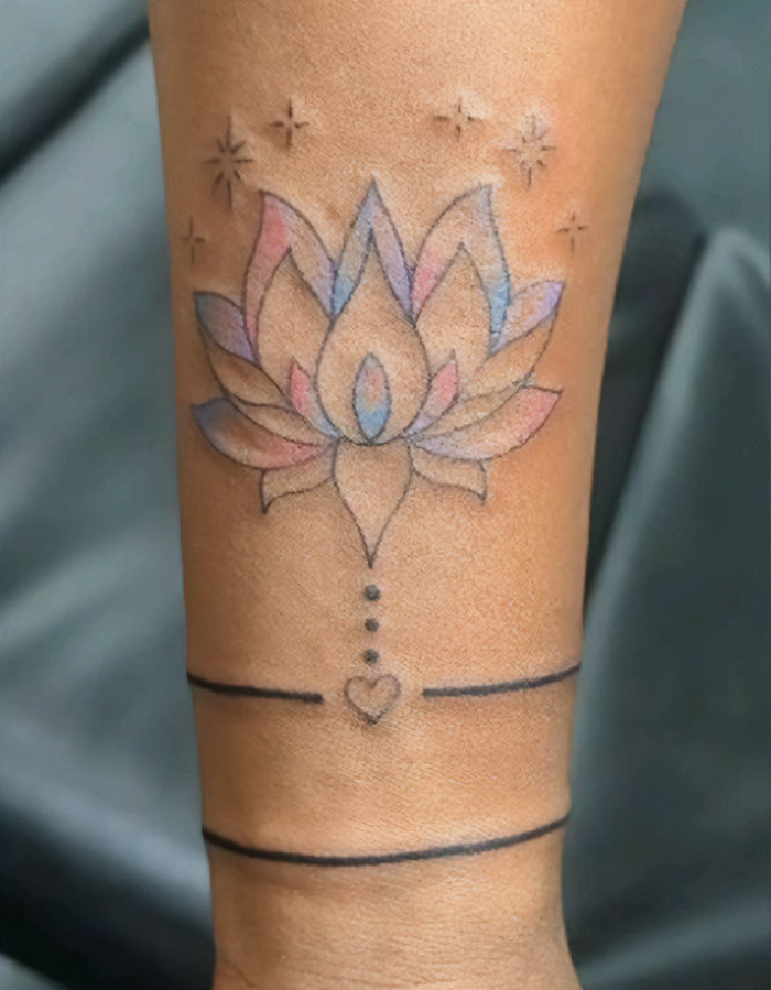 Pastel colors lotus armband tattoo