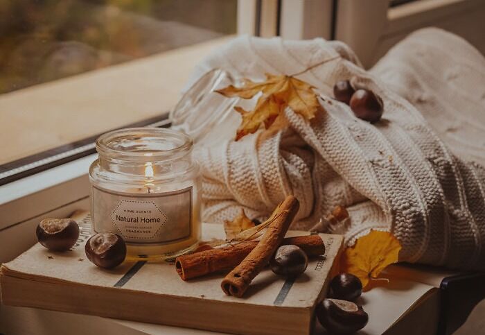 Candle with other decorations on a windowsill