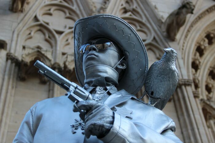 Silver Human Statue In The City Center 