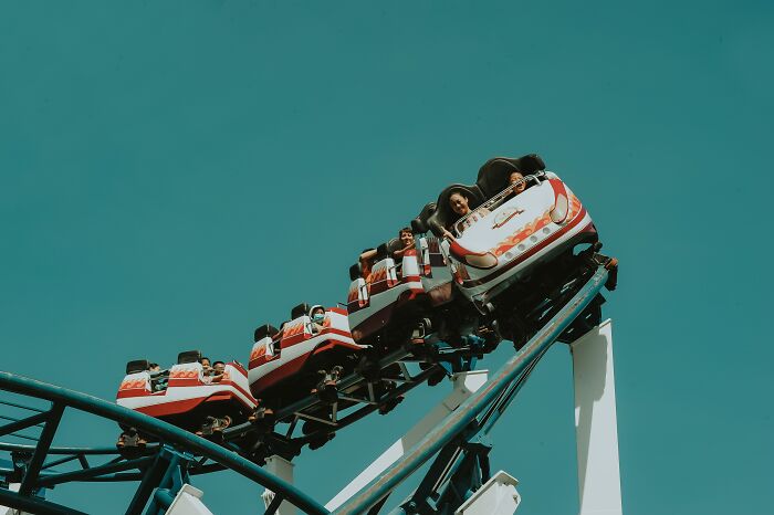 People Riding Roller Coasters