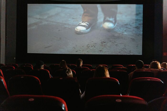 people Watching Movie In The Cinema 