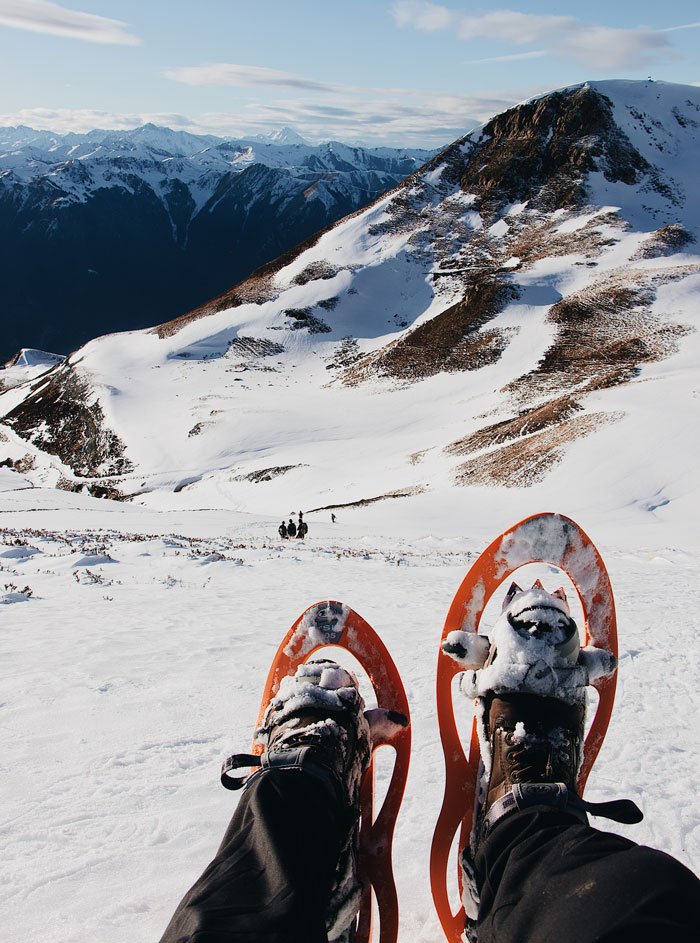 Person hiking in snowy mountains 