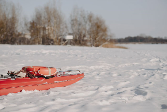 Red sled in a snow 