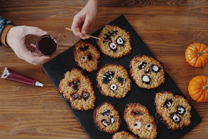 Person decorating cookies 