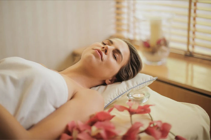 Woman laying and relaxing at the Spa 