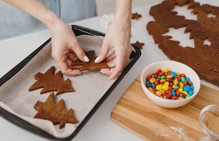 Woman baking ginger cookies 