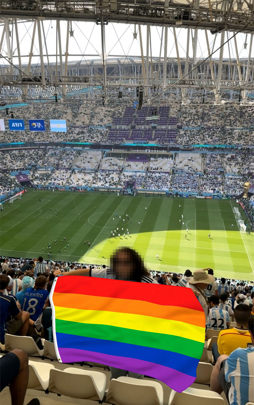 Exclusive: Soccer fans wearing rainbow-colored items stopped by