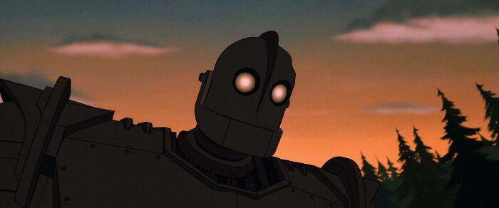 The Iron Giant in the woods during sunset 