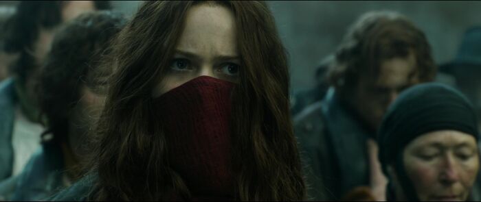 Hester wearing red mask covering her face 