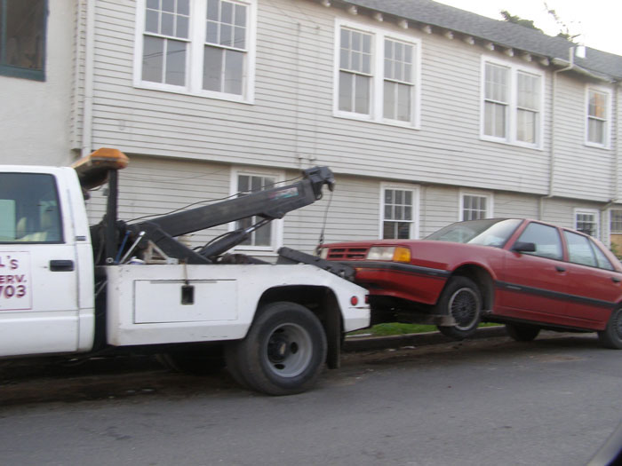 Entitled Boss Gets Placed On Leave After Wrongfully Towing Employee’s Car For Parking In ‘His Spot’