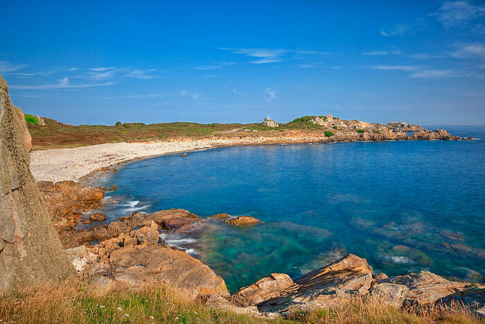 uninhabited shore with blue water