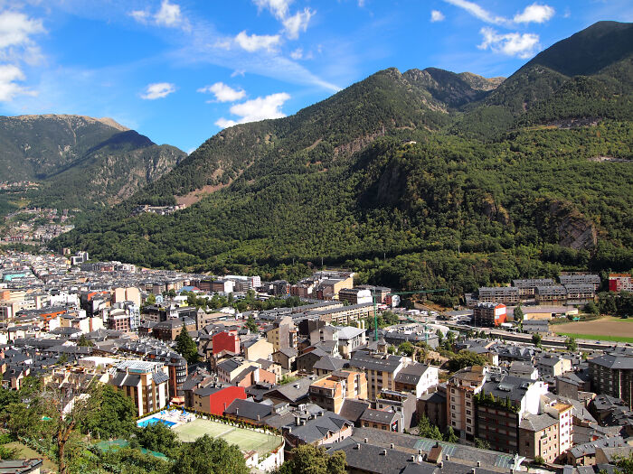 buildings on the backgrounds of hills with trees