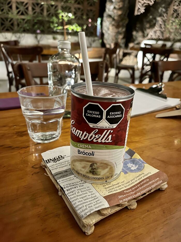 Cocktail Served In Broccoli Soup Can, On Newspaper, On A Preschooler’s Popsicle Stick Craft?