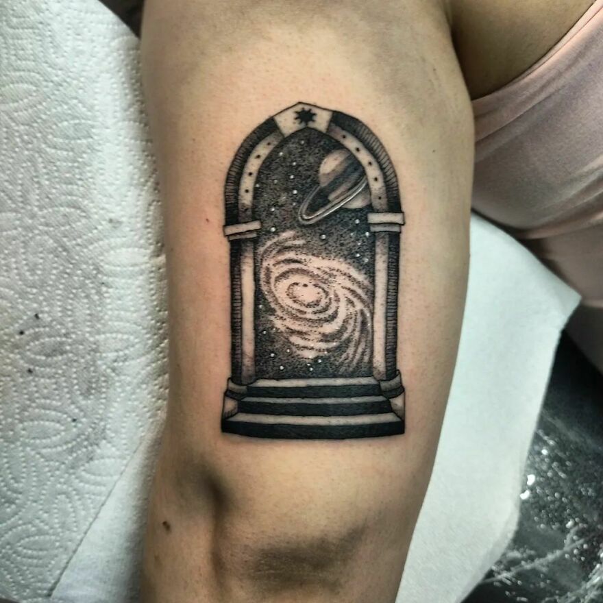 Space portal arm tattoo