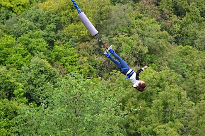 Woman Bungee Jumping From A Bridge 