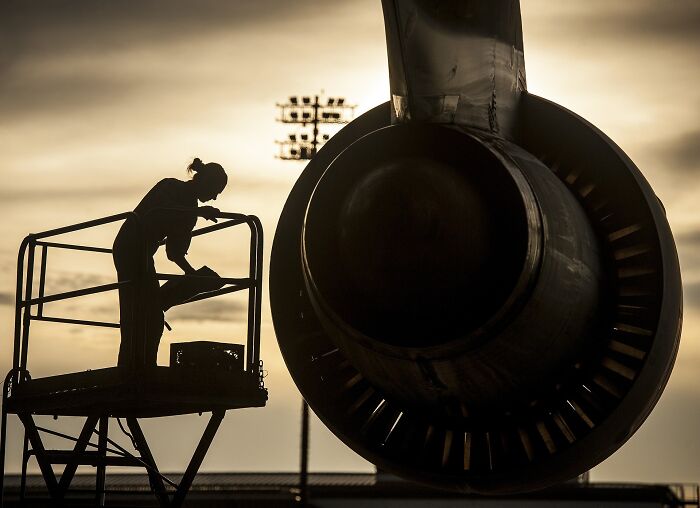 Person Near To The Airplane Turbine 