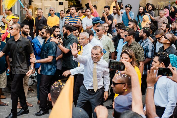 Famous Man Protected By Body Guards In Crowded Place 