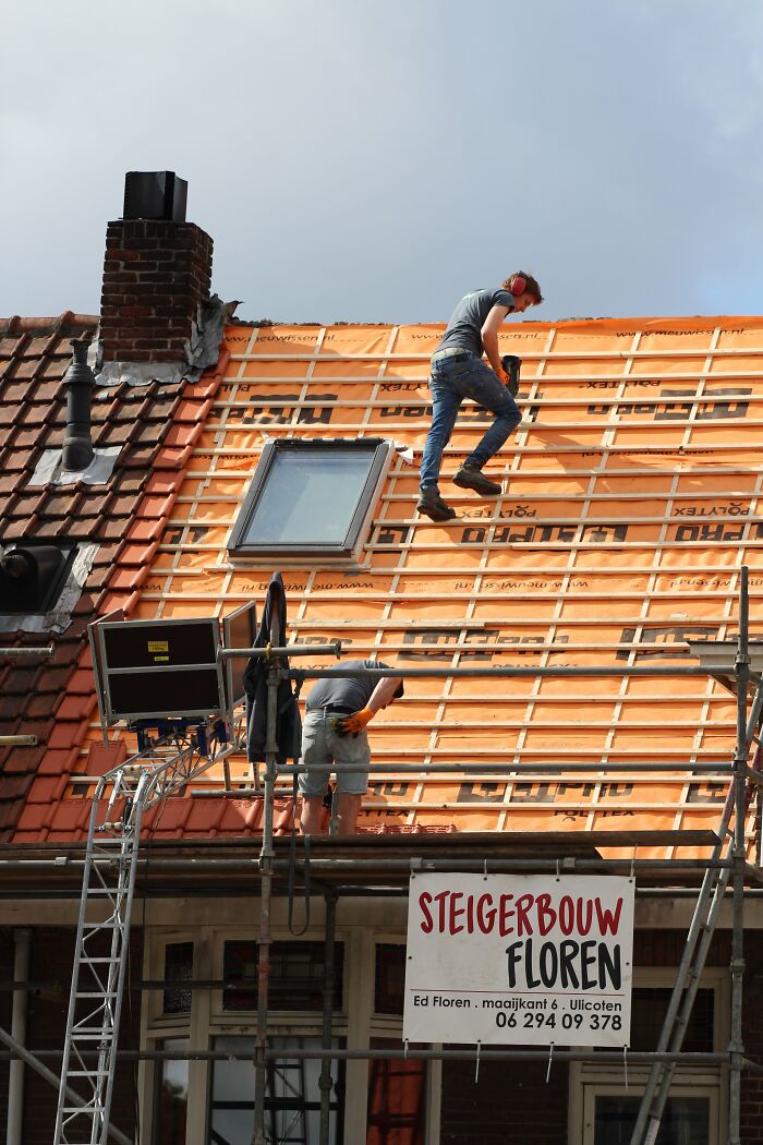 Roof Workers Laying The Roof 