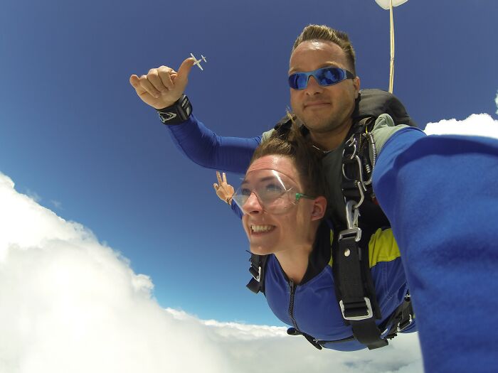 Couple Sky Diving And Enjoying Their Time 