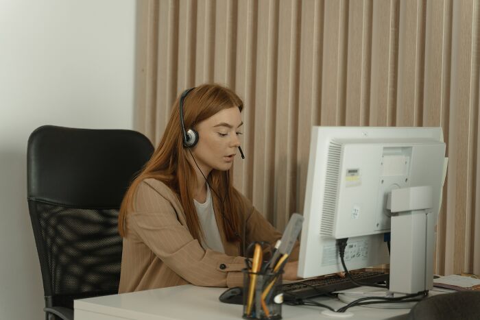 Working Woman And Consulting Her Client 