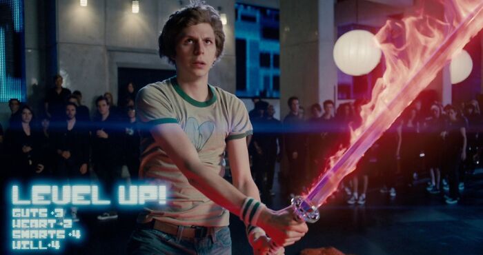 Scott Pilgrim holding flame sword 