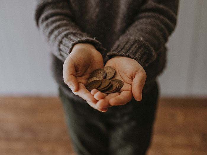 Person holding coins