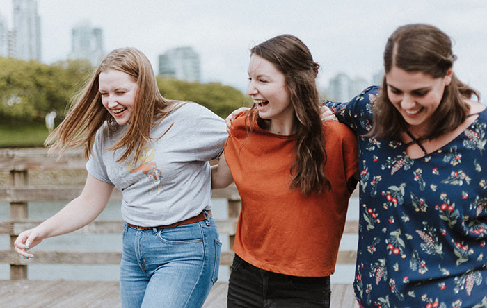 Friends walking and laughing