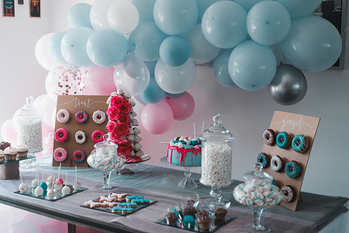 Colorful donuts, with balloons and cake