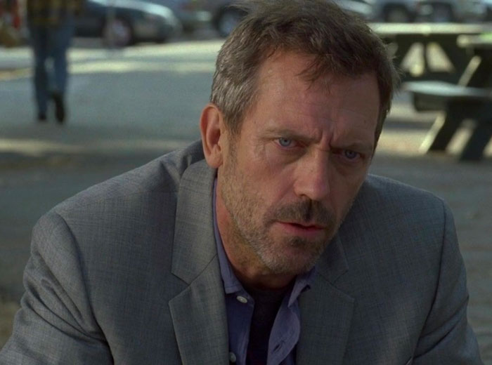 Dr. Gregory House wearing brown jacket 