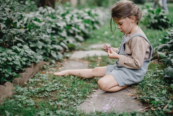 Kid Sitting On Ground 