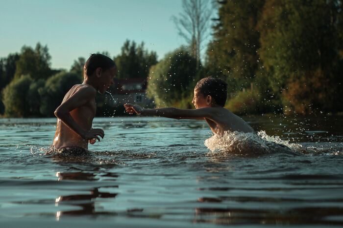 Kids Playing In Lake 