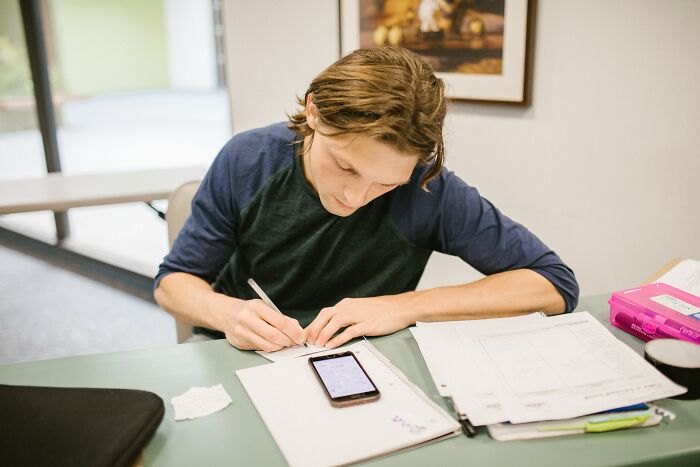 Man Taking Notes From Phone 