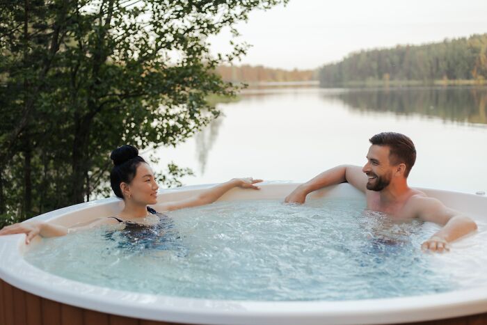 Couple Talking While In Hot Tub 