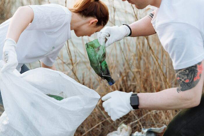 Couple Collecting Trash 