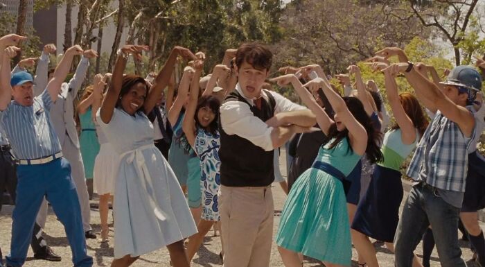 Tom Hansen dancing outside with a crowd