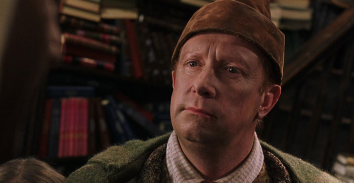 Arthur Weasley looking from Harry Potter