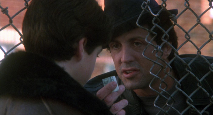 Rocky giving boy money from Rocky V