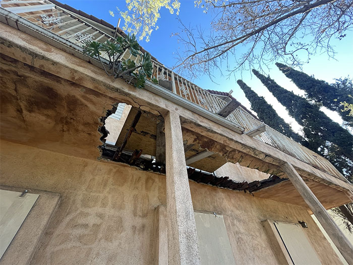 This Photo Serves As A Reminder Of The Dangers Of Neglecting Issues In Your Home Or Building. The Substantial Hole In This Balcony Floor Is A Result Of Deferred Maintenance, Putting Both The Home And Homeowner At Risk. By Investing In Regular Upkeep And Repairs, The Life And Safety Of A Structure Can Be Greatly Improved