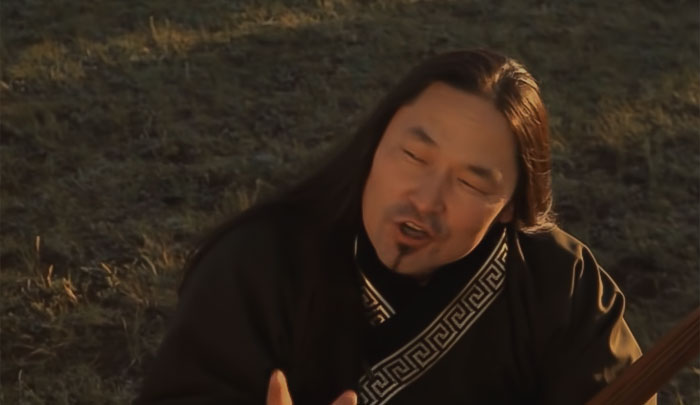 Saidash Begzy Oglu Mongush is throat singing on the grass