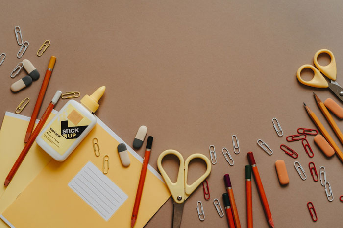 study supplies lying on the brown backgrounds